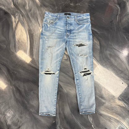 AMIRI MX1 Distressed Skinny Jeans