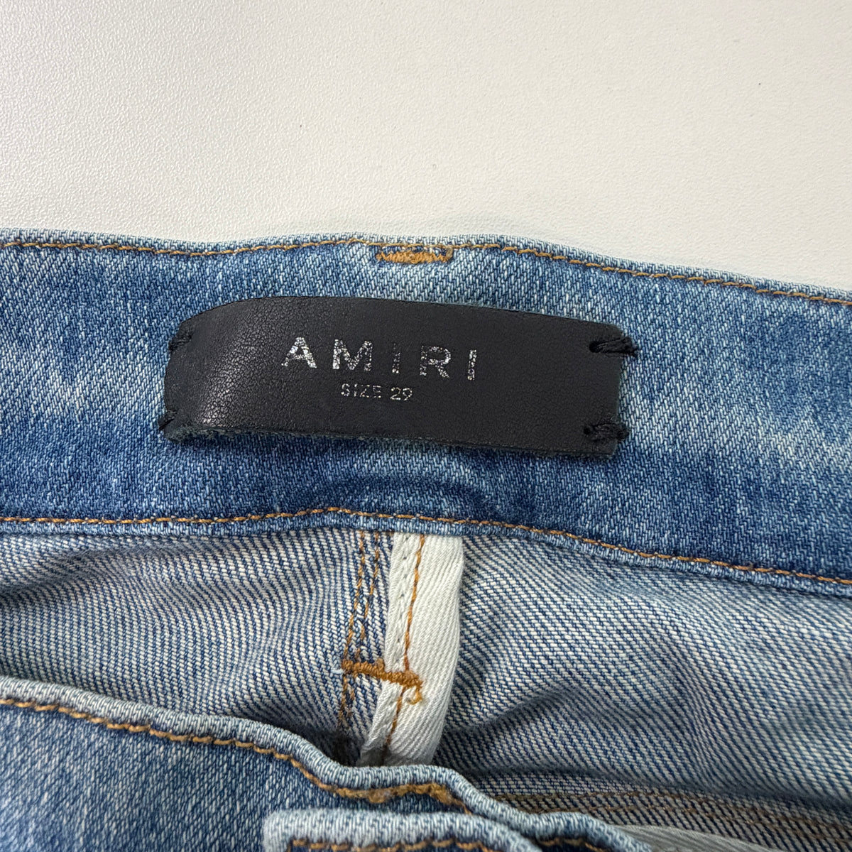 Amiri Distressed Repaired Denim Jeans with Logo