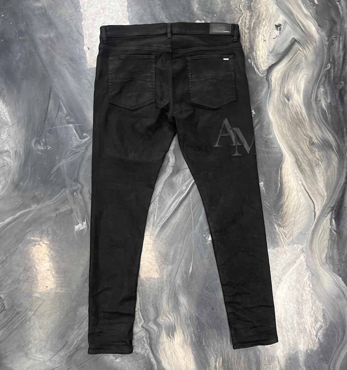 Amiri Staggered Logo Waxed Skinny Jeans