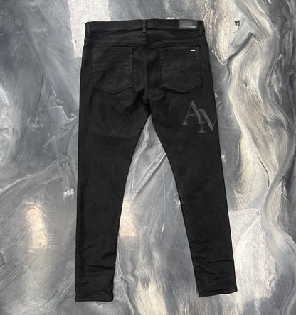 Amiri Staggered Logo Waxed Skinny Jeans