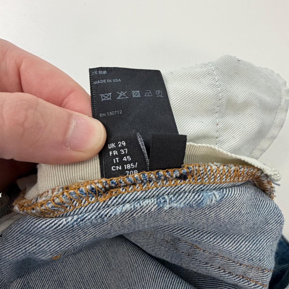 Amiri Distressed Repaired Denim Jeans with Logo
