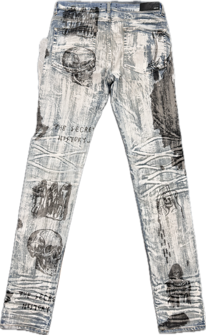 AMIRI Wes Lang All Over Print Light Wash Denim Jeans
